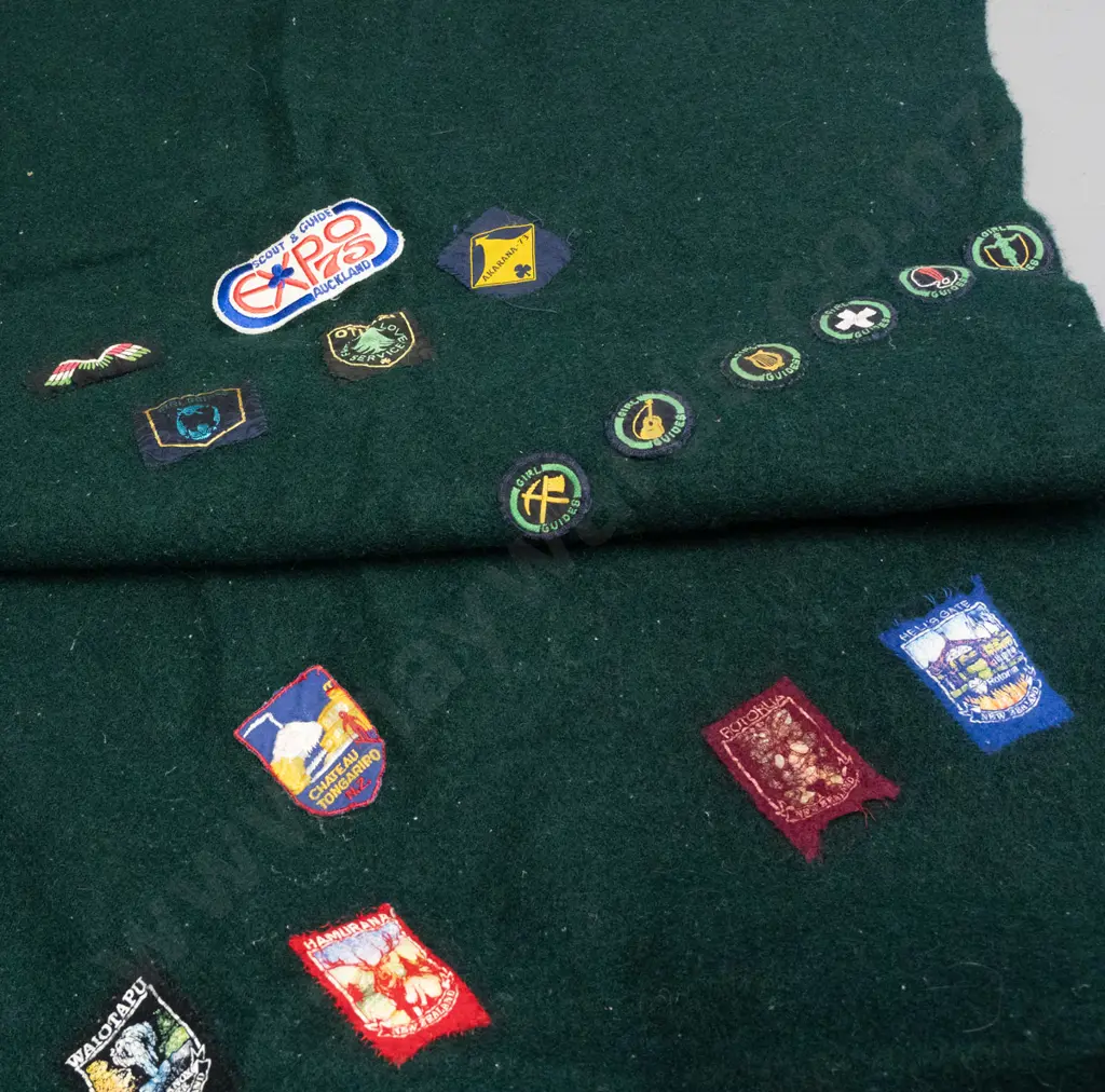 green woollen blanket with Onehunga label and numerous Girl Guides and other badges & NZ souvenir pennants - wear and a Image 1++