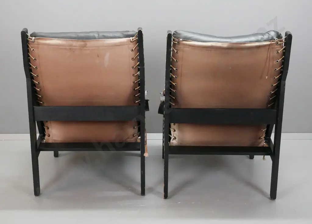 pair of retro timber and black leather slung back lounge chairs with canvas seat and back strung through frame, leather Image 1++