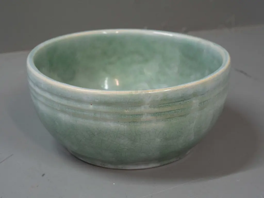 (Crown Lynn?) bowl with hard to read (J8, 38?) mark and 15/5 fraction mark. Overall crazing to celadon green over blue Image 1++