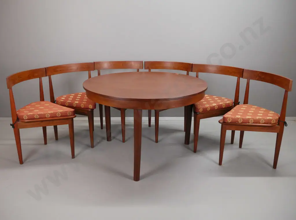 retro teak round dining table w/round legs, 6 tri-form chairs with curved saddle backs & upholstered squabs. Table H-760 Image 1++