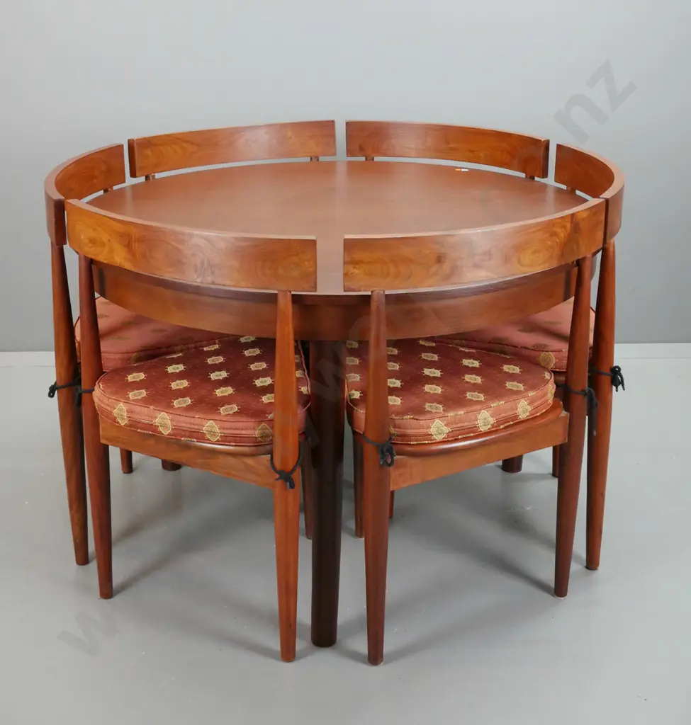 retro teak round dining table w/round legs, 6 tri-form chairs with curved saddle backs & upholstered squabs. Table H-760 Image 1++
