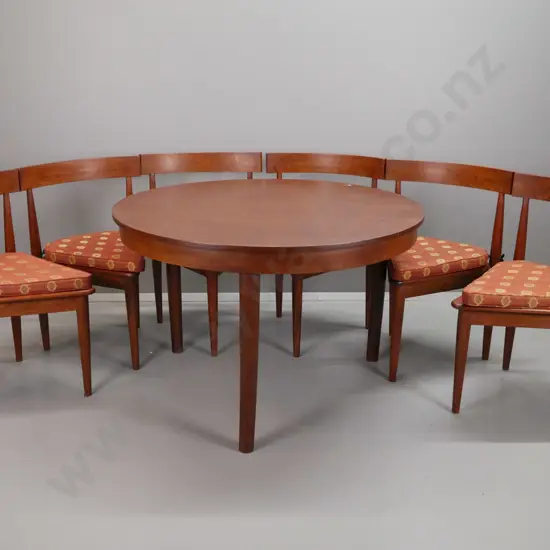 retro teak round dining table w/round legs, 6 tri-form chairs with curved saddle backs & upholstered squabs. Table H-760