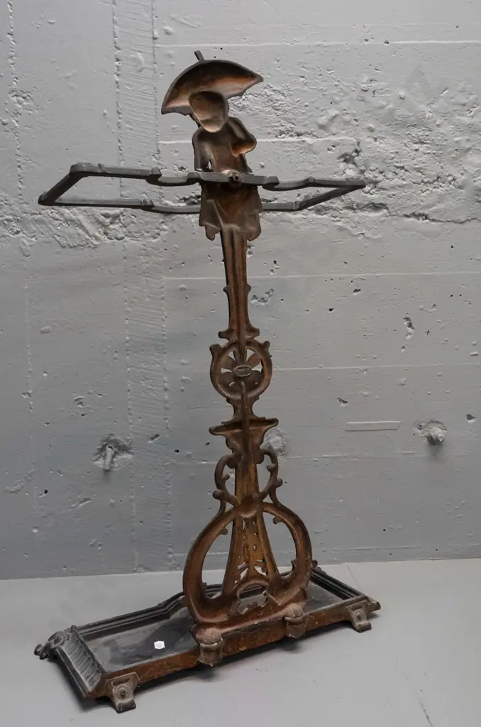 ornate cast metal umbrella stand with dolphins and child with umbrella motifs, 2 piece, both marked "Deponirt" - back Image 1++