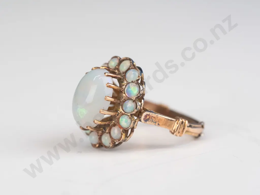 1 opal cluster ring 14ct gold 4.7grams centre raised opal surrounded by 14 round carbon cut small opals 2.3mm Image 1++