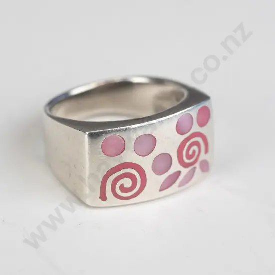 silver ring with pink swirls