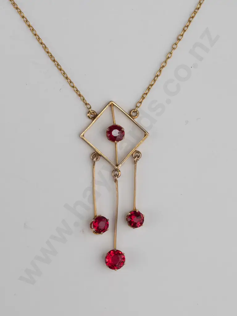 9ct gold drop pendant with tongue & tube catch square with 3 drops each set with red stones & in centre of main frame Image 1++