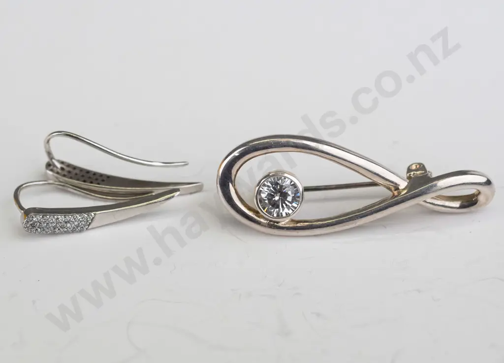 silver brooch with cz stamped 925 & pair of silver earrings no mark Image 1++