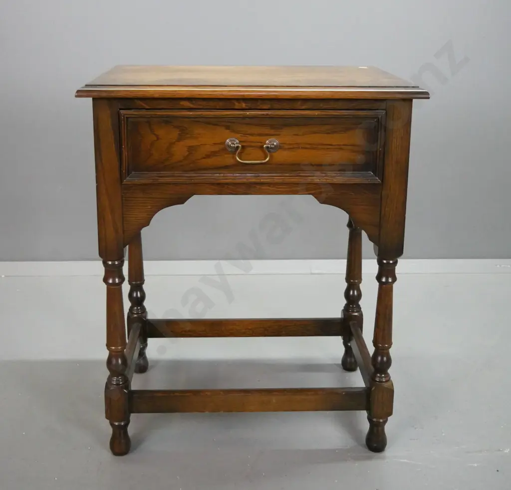oak side table with single drawer, brass swan neck handle, arched sides and front, turned legs on stretcher base H740 Image 1++