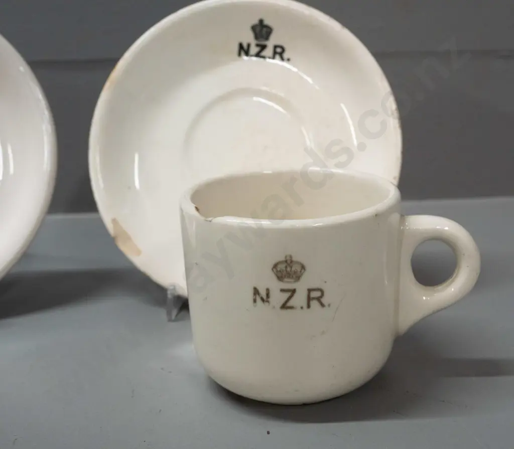 New Zealand Railways logo crockery - Crown Lynn mug and 2 saucers and a Temuka mug - all with staining and chips. Image 1++