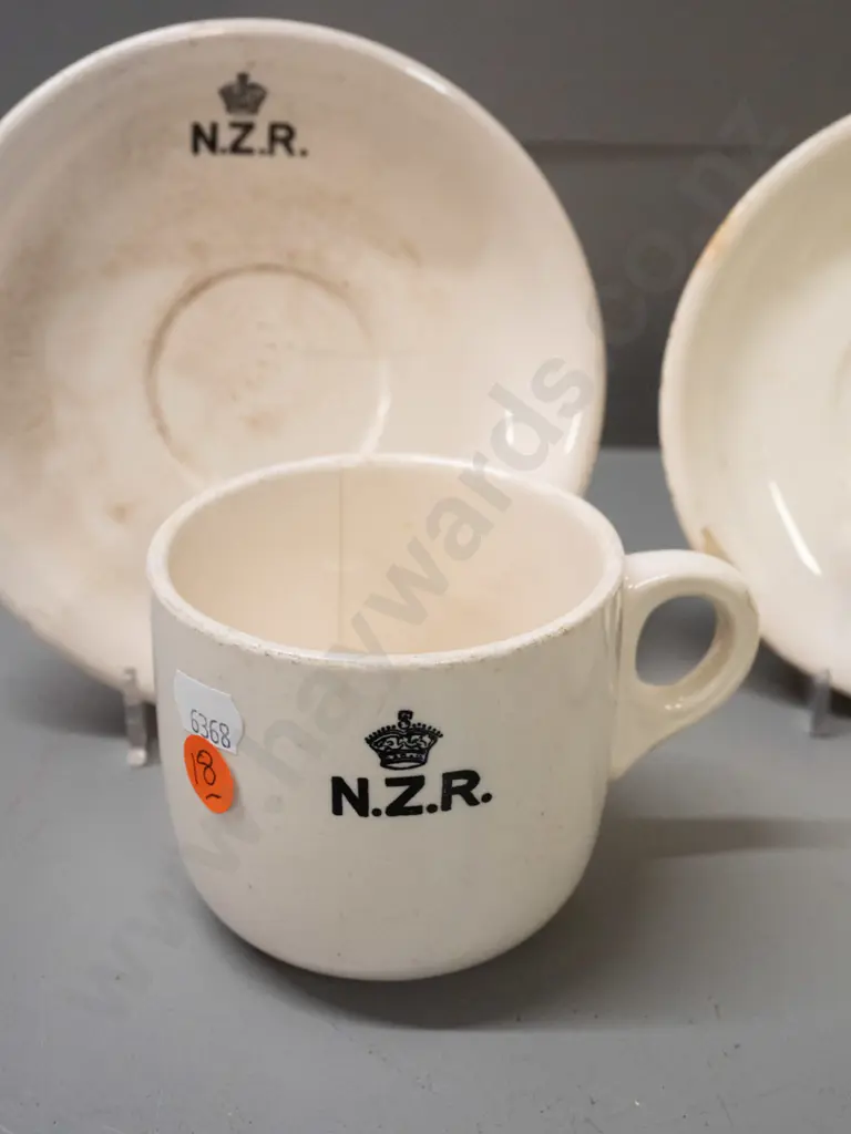New Zealand Railways logo crockery - Crown Lynn mug and 2 saucers and a Temuka mug - all with staining and chips. Image 1++