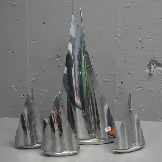 4 ornamental chrome yachts - largest one has some corrosion at base of mast H-360 L-180