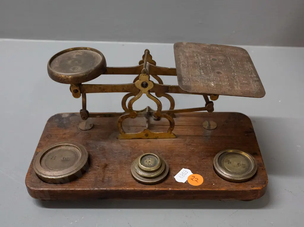 brass postal scales on timber base, with weights, plate is etched with postal rate information, indicator needle is Image 1++