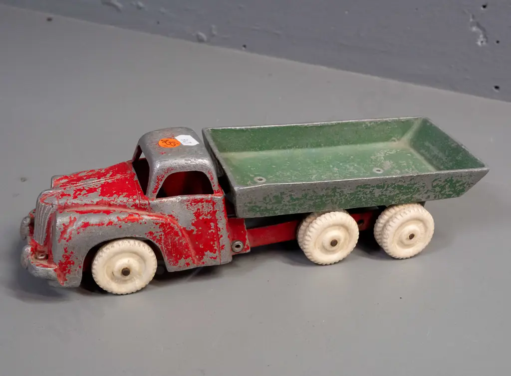 Fun Ho cast metal tip truck with white wheels, marked No. 502 on underside of tray. Paint wear and one door dented Image 1++