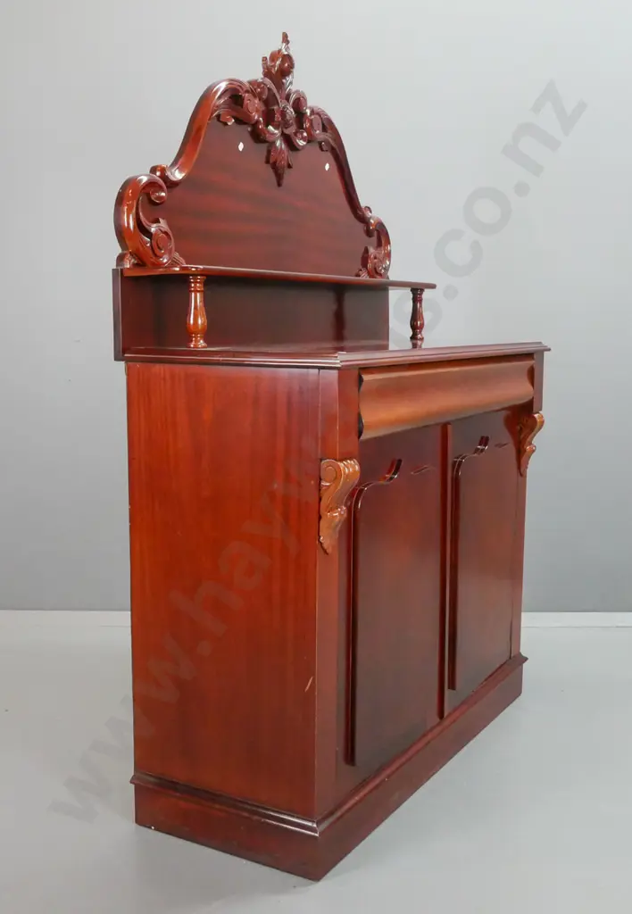 reproduction mahogany carved-back chiffonier, shaped top drawer above shield cupboard doors, 2 carved corbels, lock and Image 1++