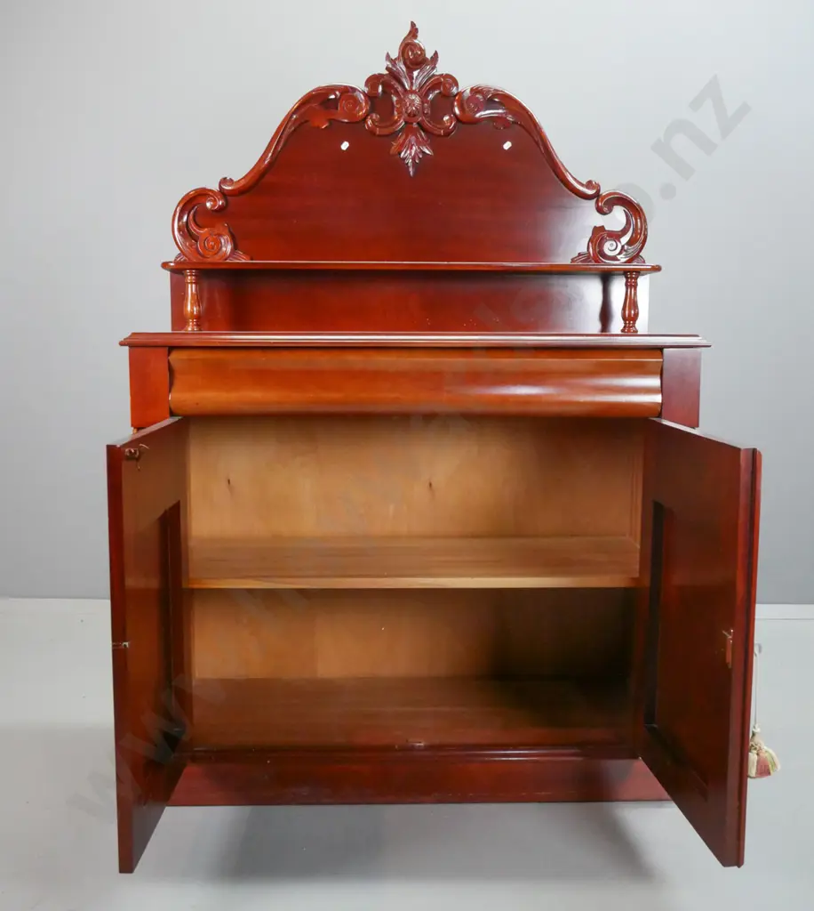 reproduction mahogany carved-back chiffonier, shaped top drawer above shield cupboard doors, 2 carved corbels, lock and Image 1++