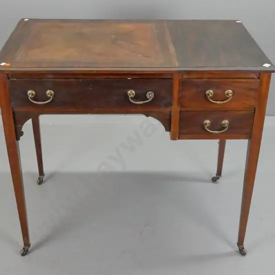 Edwardian mahogany Sheraton style writing desk with one long and 2 small drawers, tooled leather insert, square tapered