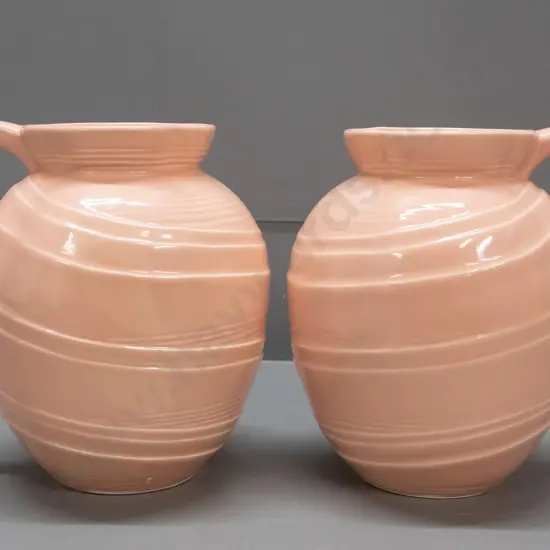 pair of deco style pink ceramic jugs marked Made In England 1342 on base - some staining H-190 W-180