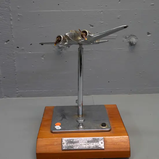 cast metal chrome finish model aeroplane on timber base - Air Speed Oxford 1939-45. One timber propellor broken, missing