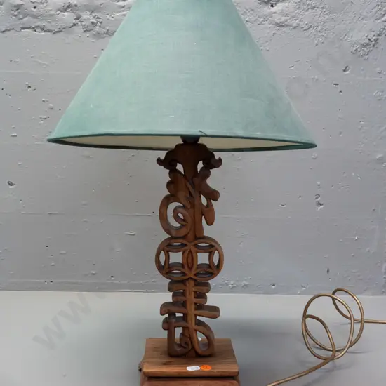 retro carved and pierced asian hardwood table lamp with stylised letter forms and geometric shapes, on bracket feet w/