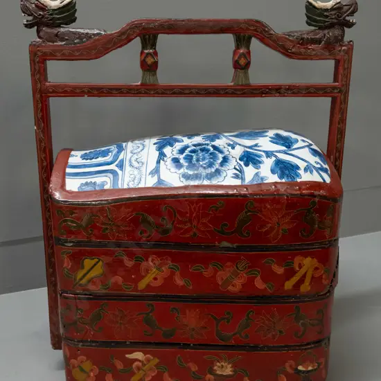 Chinese timber & papier mache multi-tray handled carrier with blue and white porcelain top lid, carved dragon heads on
