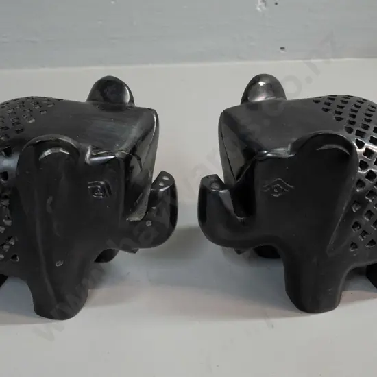 pair of pierced and carved black stone elephants H-125 L-150