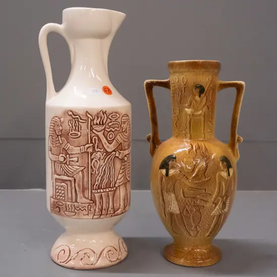 2 Aquila Ceramics NZ items with Egyptian motifs - ewer jug and double handled ewer with textured glaze. Lighter coloured