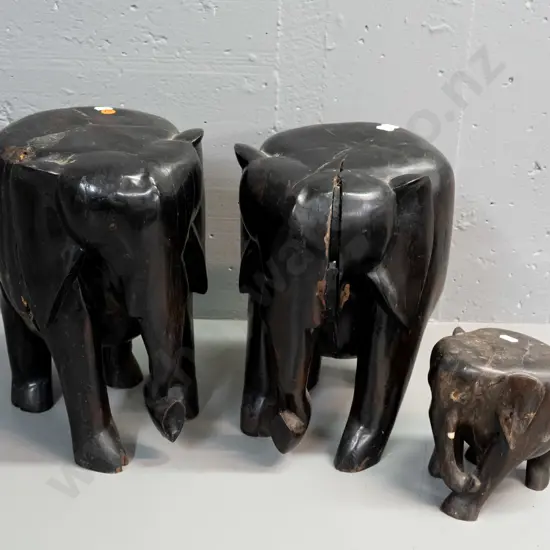 3 very heavy carved ebony flat-topped elephant stands or ornaments, missing eyes and tusks - splits to all, one has very