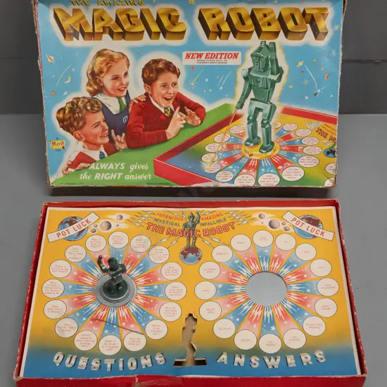 vintage Magic Robot game with spinning robot figure, pointed detached, needs some attention, and box has heavy wear.