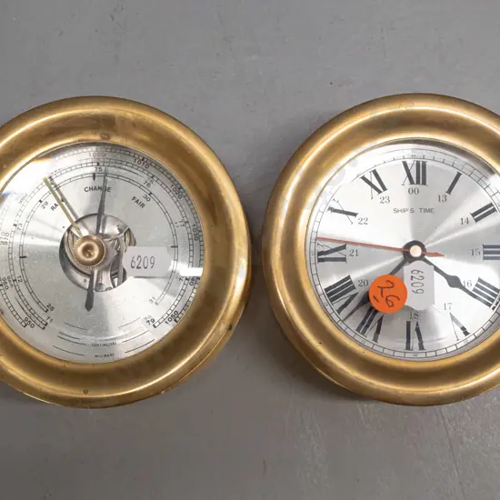 clock and barometer in matching brass nautical style cases - some oxidisation. Cases are diameter 115 and depth 70