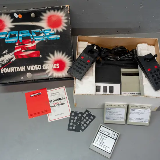 1980s Fountain Force 2 video game console with 2 controllers and 3 games cartridges - some damage to plastic console top