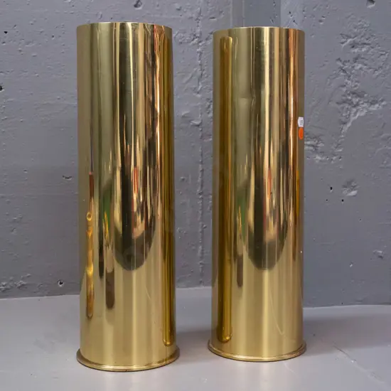 pair of polished brass shell case vases - both with 1966 date on base - some denting H-370