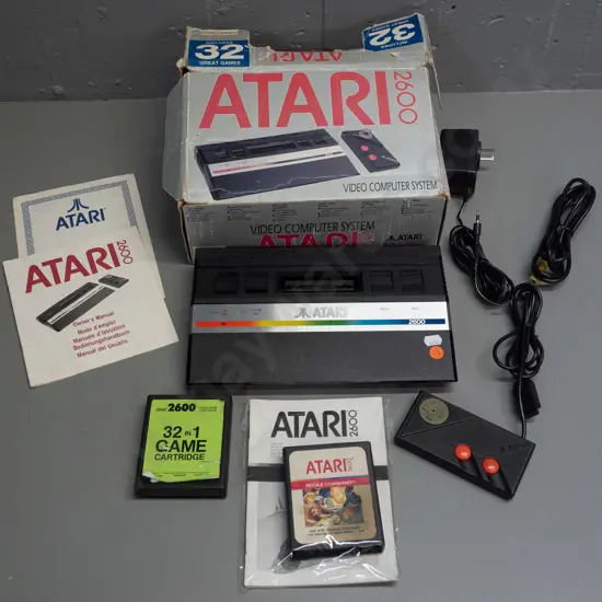 Atari 2600 game console with one controller, 2 games - joystick knob has snapped off controller - box is worn - untested