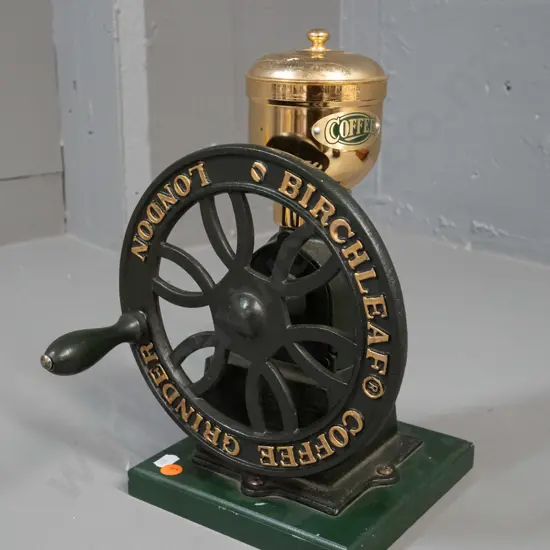 cast iron, brass and timber coffee grinder with large flywheel handle, marked Birchleaf London - action seems rough, may