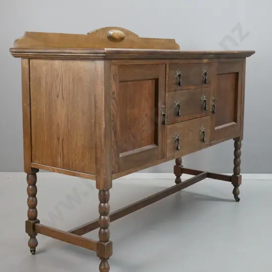 deco style oak 3-drawer 2-door sideboard with shaped upstand, on bobbin turned legs & stretcher base, drawers lined,