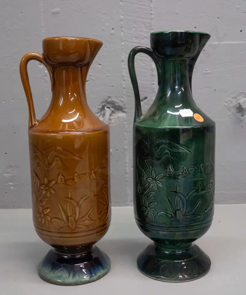 2 NZ ceramic handled ewer vases with heron motif designs - one marked Orzel and one Aquila Ceramics NZ H-310 Image 1++