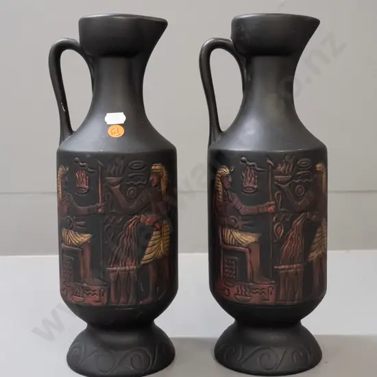 pair of Aquila Ceramics NZ handled ewer jugs with matte glaze, Egyptian motifs - one has small chip to base, some