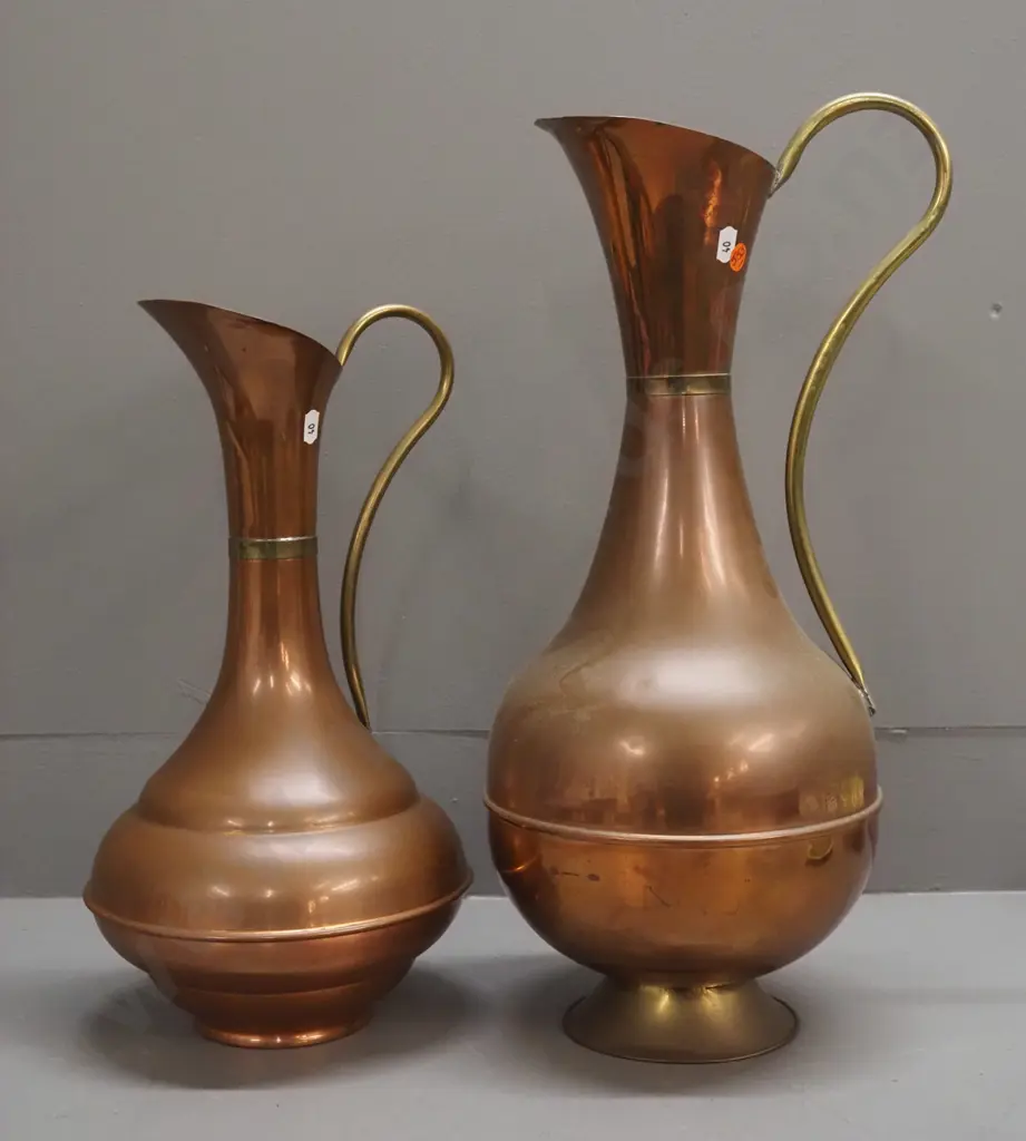 2 copper and brass ewer jugs with flared bases, one base is brass, one copper, both with a bit of wear, larger one has Image 1++