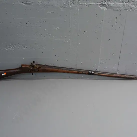 reproduction vintage flintlock  rifle or musket with extensive damage to timber L1260