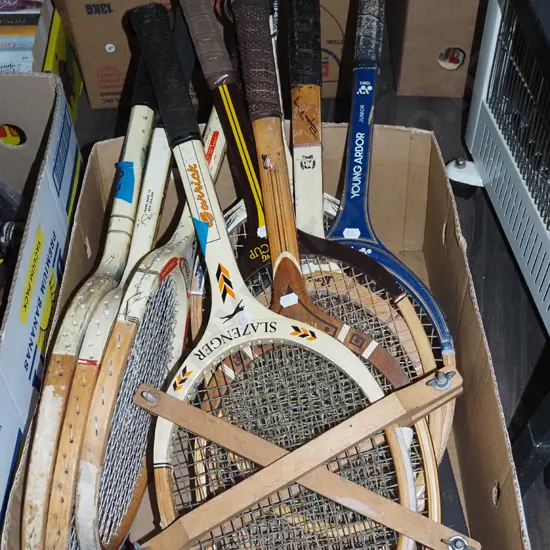 box of vintage tennis rackets