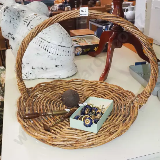 ornate cupboard handles, small canon ball, cane basket etc