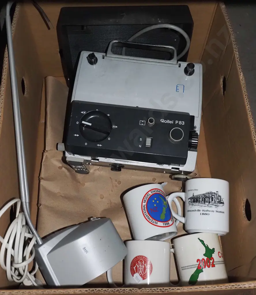box; halogen desk lamp, coffee cups, Super 8 movie projector  Image 1++