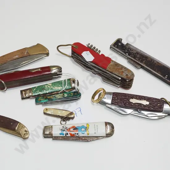box of vintage pocket knives