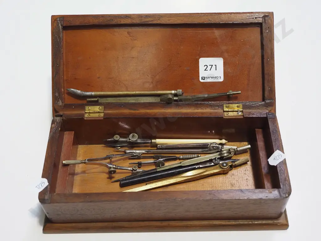 wooden lidded box with various compasses and protractors Image 1++