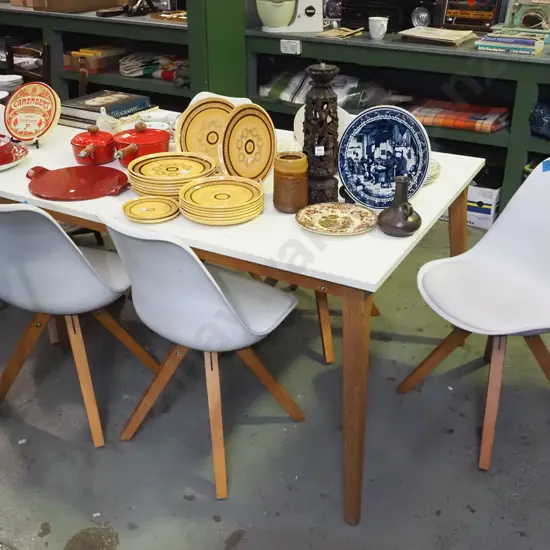 white melteca top dining table with oak legs and 6 white plastic chairs H-760 W-1650 D-1040