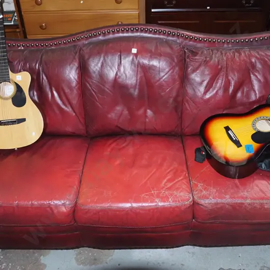 red leather rolled arm 3 seater settee with heavy dome studs - significant wear and tears to leather 