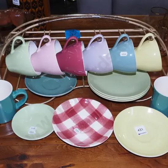 Crown Lynn cups, saucers, plates on retro wire rack