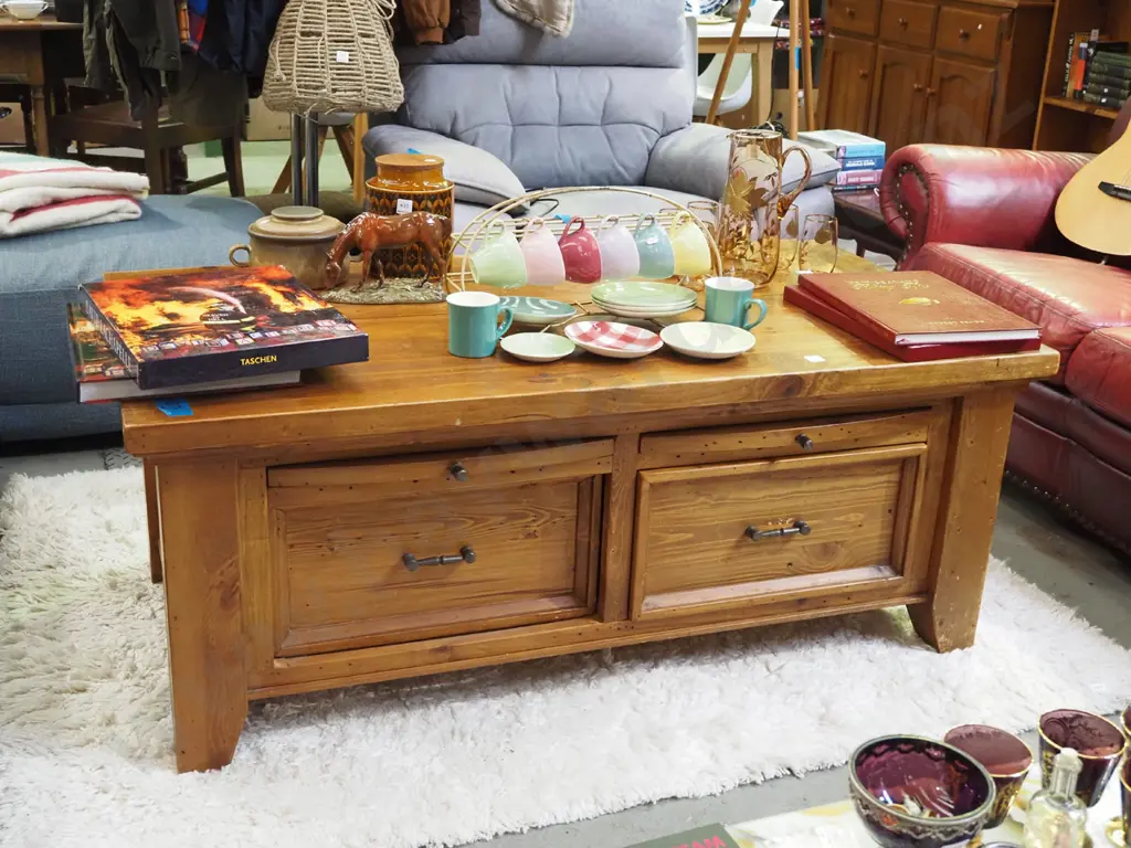 heavy pine coffee table with 2 pull through drawers and 4 pull out shelves - some wear to varnish Image 1++