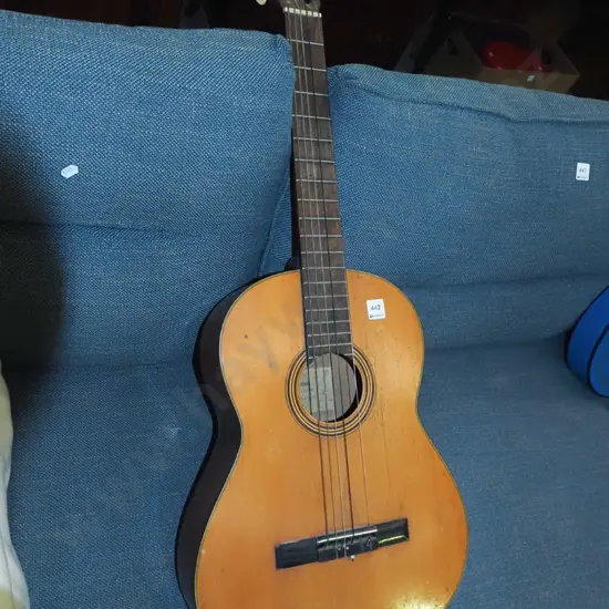 beaten Yamaha acoustic guitar