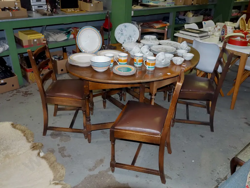 solid oak gate leg extending dining table with 5 brown vinyl ladder back chairs  Image 1++