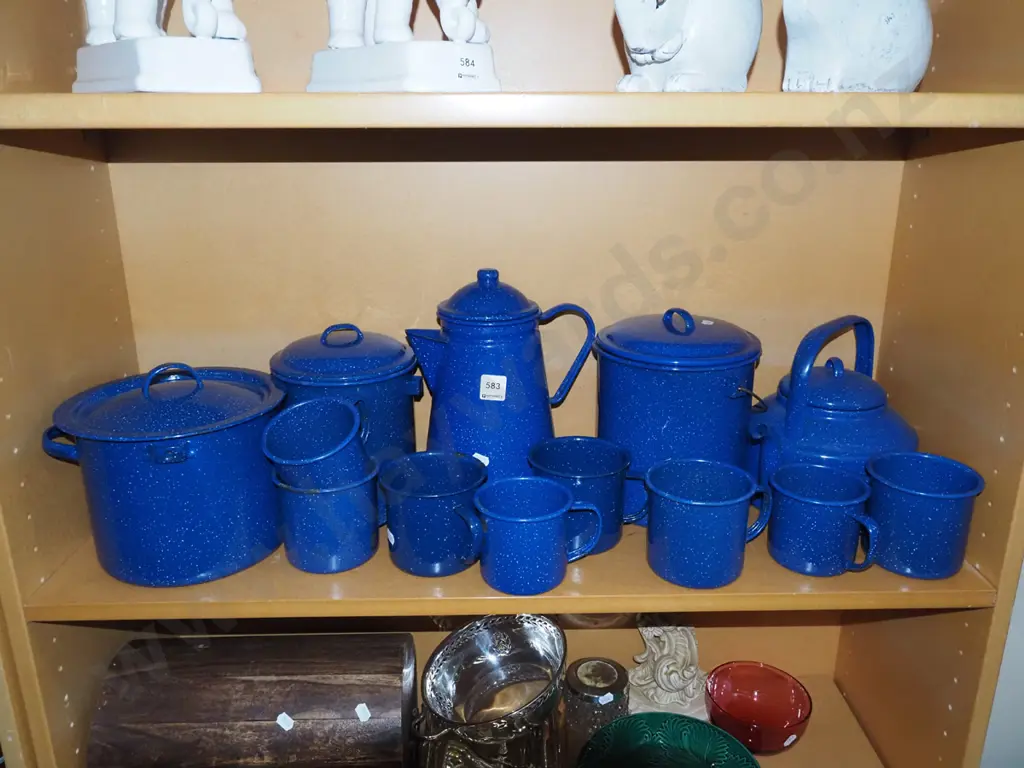 shelf of blue speckled enamel ware Image 1++